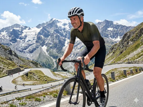 Cyclist climbing a mountain road